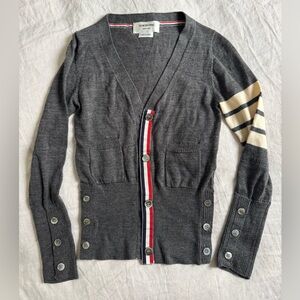 Thom Brown: Classic Luxury Merino WOOL 4-BAR V-NECK CARDIGAN. Made in Italy.